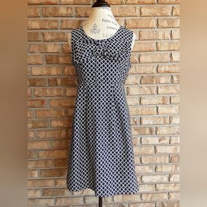 Mieko Mellucci Geometric Print Sleeveless Dress with Bow Detail.